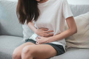 Woman Experiencing Abdominal Pain