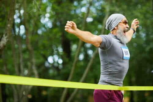 Elderly Man Crossing The Finish Line 