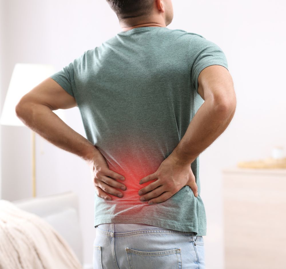 A Person Suffering From Back Pain In Itasca