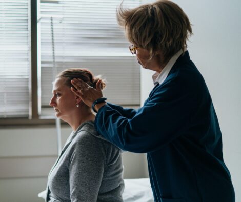 A Specialist Massaging A Person's Head